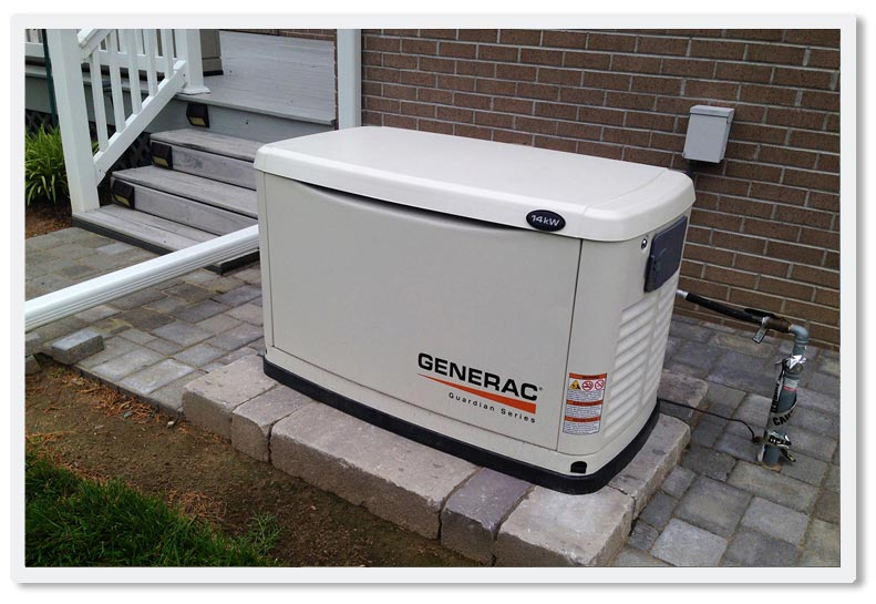 Generac whole home generator sitting on top of concrete pavers next to the brick wall of a home