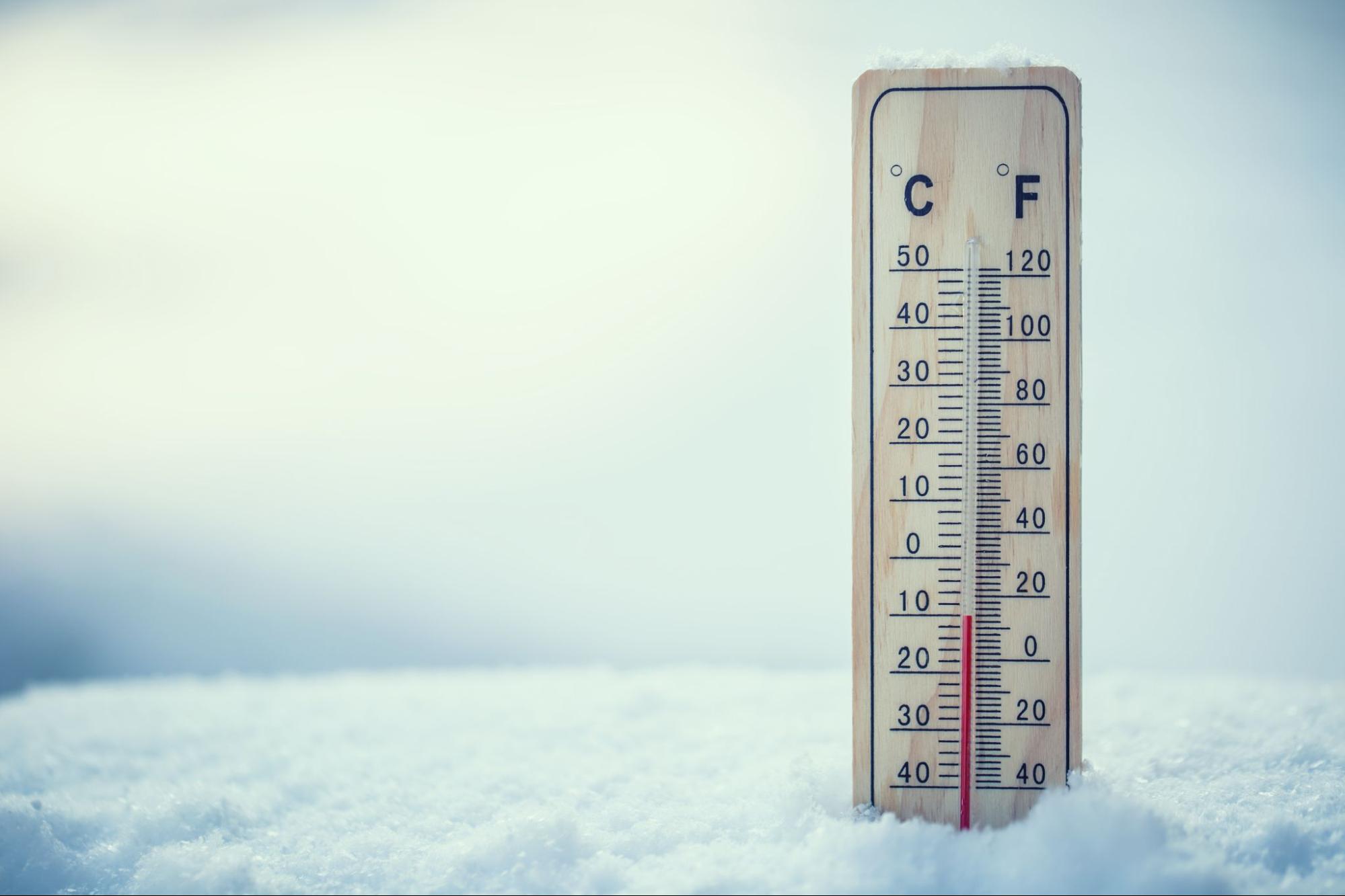 Mercury thermometer on snow shows low temperatures