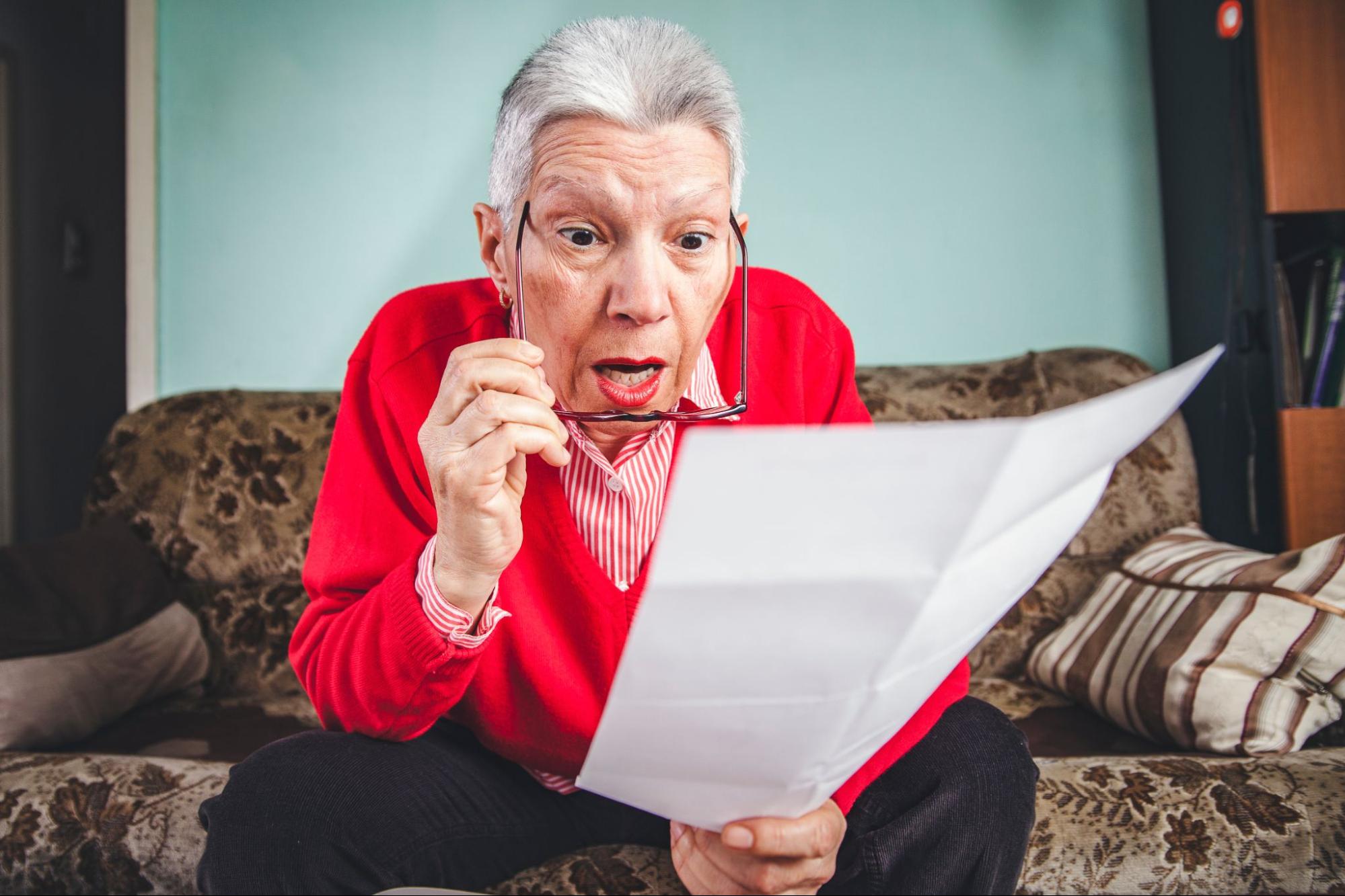 Senior woman shocked at her high heating bill